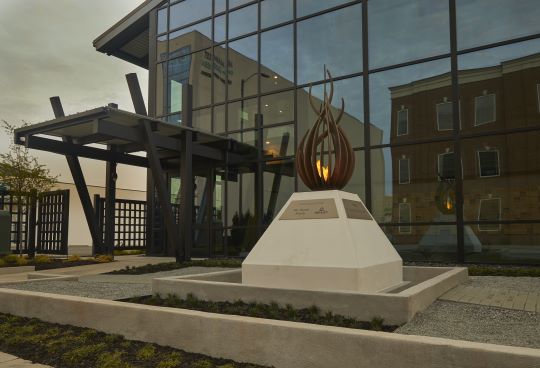 Wanek family, Ashley Furniture eternal flame sculpture placed at American HF Hall of Fame